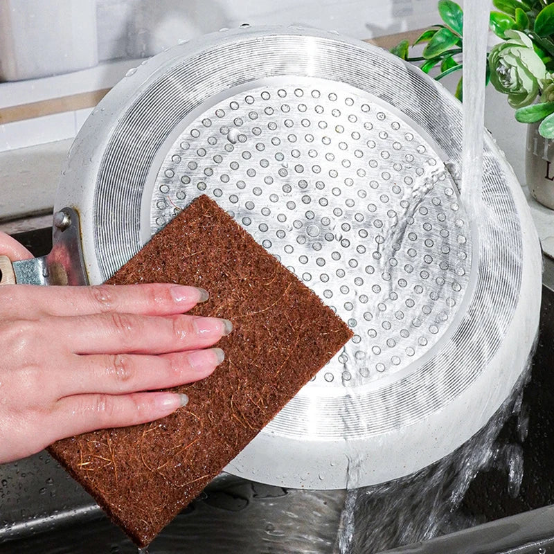 Eco-friendly cleaning sponges in a set, including sisal and microfiber scour pads for sustainable kitchen cleaning.