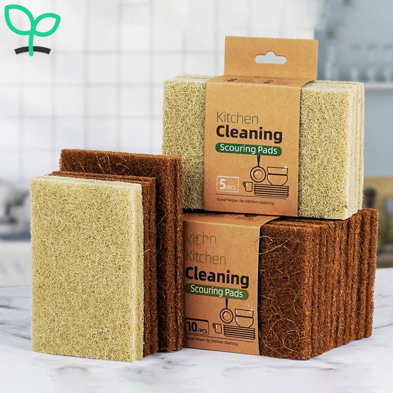Eco-friendly cleaning sponges in a set, including sisal and microfiber scour pads for sustainable kitchen cleaning.
